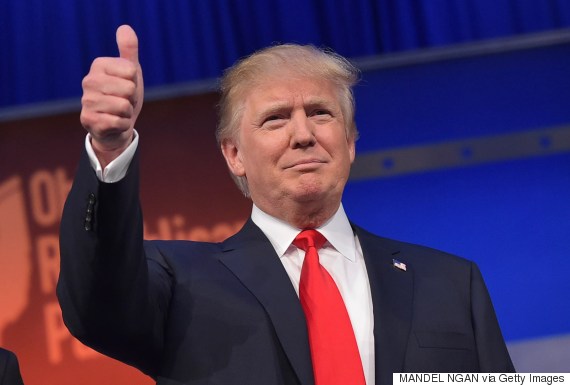 Real estate tycoon Donald Trump flashes the thumbs-up as he arrives on stage for the start of the prime time Republican presidential debate on August 6, 2015 at the Quicken Loans Arena in Cleveland, Ohio. AFP PHOTO/MANDEL NGAN        (Photo credit should read MANDEL NGAN/AFP/Getty Images)